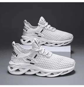 Detailed side view of men's white breathable fly-knit mesh running sneakers with thick soles