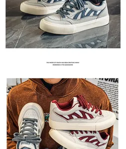 Vue détaillée de baskets élégantes en mesh respirant pour hommes en gris et rouge.