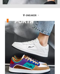 Detailed view of stylish men's low-top sneakers in white and multi-color patchwork.