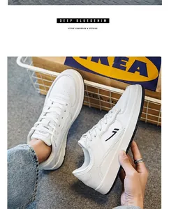 Men's stylish white leather board shoes featuring side logo and lace-up closure detail.