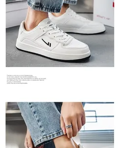 Side view of white breathable men's fashion sneakers worn with blue denim jeans