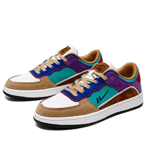 Fashionable multi-colored men's low-top skate shoes featuring suede and leather panels