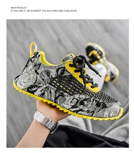 Vista dettagliata delle sneakers da uomo in mesh traspirante in grigio e giallo sportivo