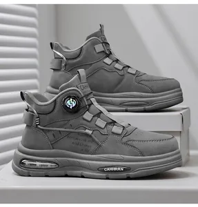 Detail shot of grey high-top men's sneakers with rotating buckle and thick sole.