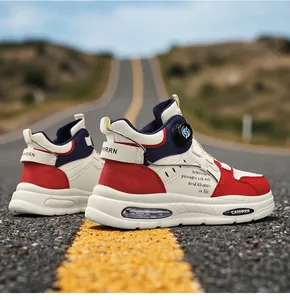 Stylish men's high-top sneakers with rotary buckle and air cushion on asphalt road