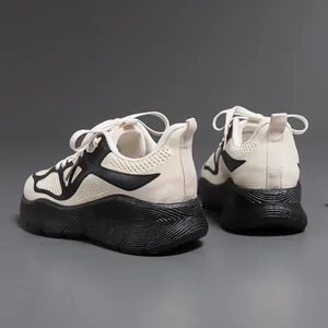 Rear view of ultra-lightweight men's running shoes in beige and black mesh fabric.