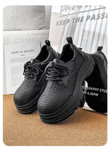 Detailed view of men's black platform derby shoes with woven texture