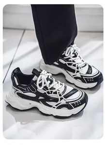 Detailed close-up view of men's retro black and white chunky sneakers with comfortable soft sole.