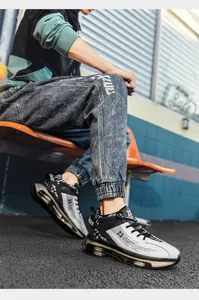 Detailed close-up of men's high-top air cushion basketball sneakers in urban street setting