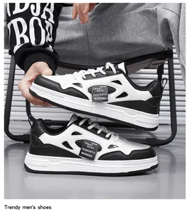 Vista detallada de zapatillas de hombre negras y blancas de tendencia con diseño original.