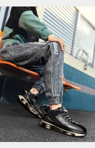 Detailed shot of black high-top basketball sneakers with golden air cushions