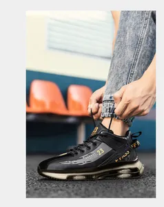 Close-up of black high-top basketball sneakers with gold '23' logo and air cushion.
