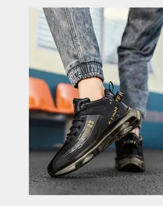 Detailed side view of black high-top basketball sneakers with air cushion sole