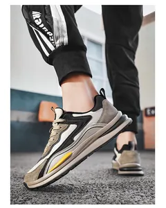 Detailed view of stylish casual leather sports sneakers in beige, black and grey tones.