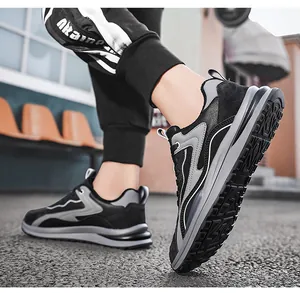Detailed view of durable black and gray men's sports work shoes with non-slip thick soles