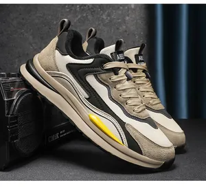 Detailed side view of men's casual sneakers featuring beige leather and suede textures