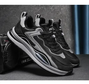 Detailed side view of stylish black and grey leather men's casual sneakers.