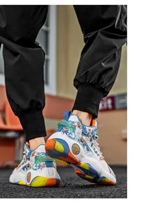 High-top men's basketball shoes with colorful soles and graphic prints for sports.