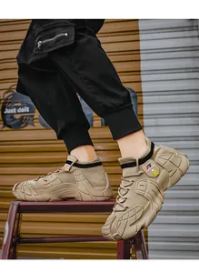 Detail view of men's beige breathable knit sneakers with chunky shock-absorbing soles