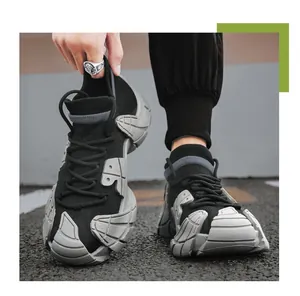 Close-up of breathable black knit sneakers with unique chunky grey sole for men