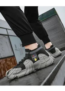 Detailed side view of men's black breathable fly-knit sock sneakers with thick grey soles