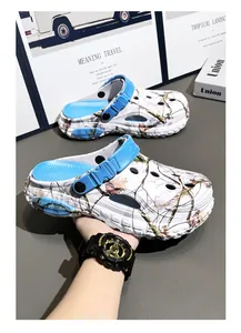 Detail view of men's camouflage clogs with blue heel strap and breathable ventilation holes