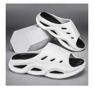 Detailed side view of white mens thick-soled sports slides featuring hollow side design