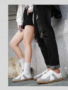 Detailed side view of classic German Army Trainers sneakers with grey suede and gum sole