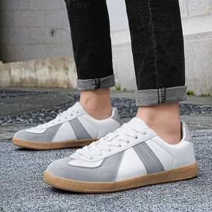 Classic white leather GAT sneakers for men featuring grey suede trim and a gum sole