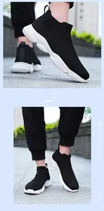 Détail de baskets en maille noire pour hommes avec semelle blanche épaisse antidérapante