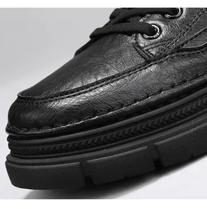 Close-up detail of black leather Martin shoes showing stitching and thick non-slip sole