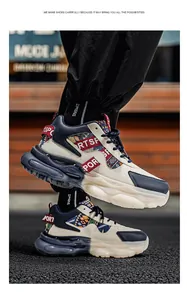Seitenansicht von Herren-Chunky-Sneakern mit Lederpanels und gemusterten Riemen.