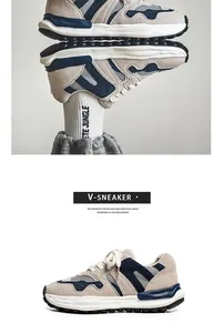 Detail of retro men's thick-sole sneakers in beige and navy blue suede patchwork