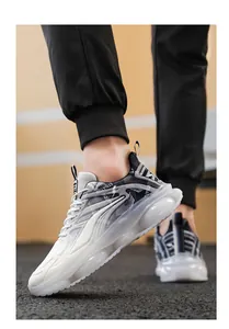 Detailed side view of white men's breathable air cushion running sneakers with thick sole