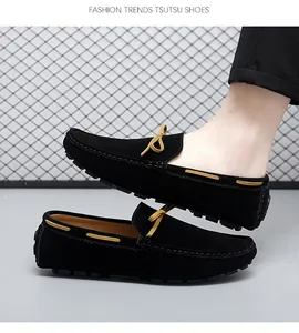 Side view of black suede driving loafers with brown lace detail