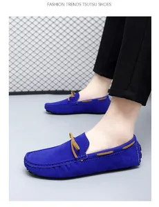 Detailed side view of trendy blue suede driving moccasins with leather bow accent
