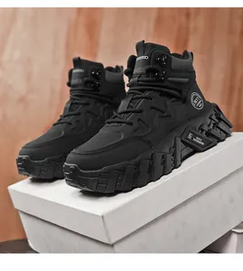 Close-up of men's black mid-top outdoor Martin boots on a white shoebox