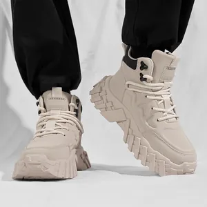 Beige chunky-soled mid-top Martin boots with futuristic gear texture.