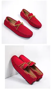 Vibrant red men's suede loafers featuring a stylish brown bow detail and slip-on design