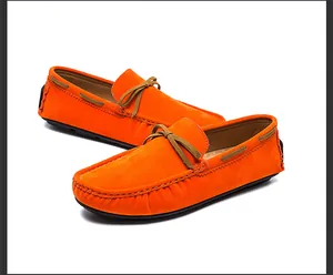 Vibrant orange men's slip-on loafers made of breathable suede for casual driving.