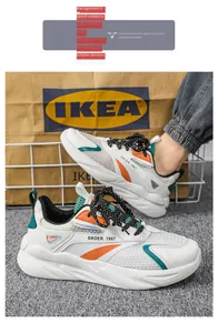 Scarpe da corsa bianche traspiranti da uomo con eleganti accenti arancioni e blu