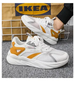 Vista laterale dettagliata delle scarpe sportive da uomo in mesh traspirante bianco e giallo