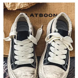 Zapatillas de lona retro de estilo desgastado con cordones gruesos y plataforma