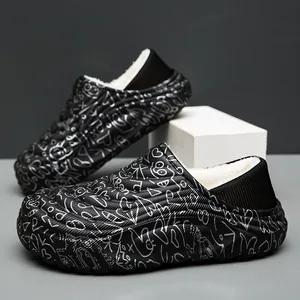 Men's black waterproof winter slippers with fleece lining and white doodle patterns.