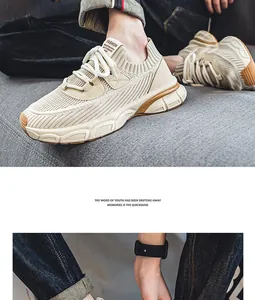 Détail de baskets beiges respirantes à semelles épaisses pour hommes style urbain