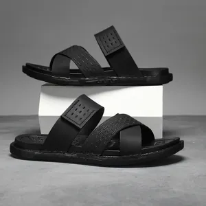 Men's stylish black thick-soled slides with cross-strap for summer outdoor wear.