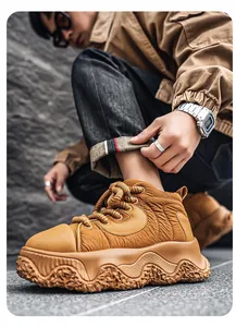 Detailed view of trendy brown thick-soled casual sneakers with unique rock-textured platform