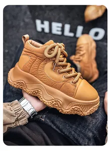 Detailed close-up of tan chunky platform sneakers featuring thick decorative rope laces