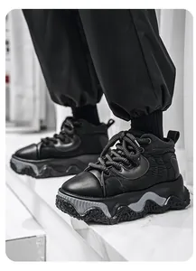 Detailed macro shot of chunky black men's board shoes with a thick wavy sole.