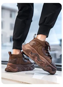 Detail view of brown chunky platform sneakers for men with quilted utility design.